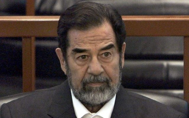 In this Dec. 6, 2006 file photo, former Iraq leader Saddam Hussein sits in court in Baghdad, Iraq, during the trial against him. (AP Photo/Chris Hondros, Pool, File) In this Dec. 6, 2006 file photo, former Iraq leader Saddam Hussein sits in court in Baghdad, Iraq, during the trial against him. (AP Photo/Chris Hondros, Pool, File)