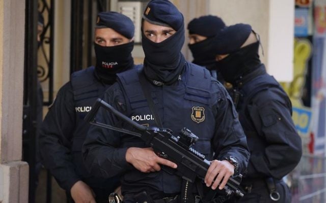 Illustrative: Spanish police officers prior to arresting an unidentified man in Barcelona, Spain, on April 25, 2017. (AP Photo/Manu Fernandez) Illustrative: Spanish police officers prior to arresting an unidentified man in Barcelona, Spain, on April 25, 2017. (AP Photo/Manu Fernandez)