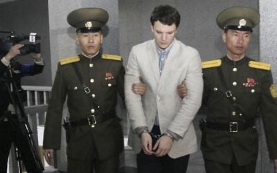Otto Warmbier, center, is escorted at the Supreme Court in Pyongyang, North Korea, March 16, 2016.  (AP Photo/Jon Chol Jin)