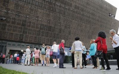 In this May 1, 2017, file photo, people wait in line to enter the Smithsonian National Museum of African American History and Cultural on the National Mall in Washington.  (AP/Pablo Martinez Monsivais, File)