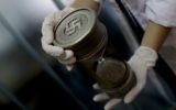 Illustrative: A member of the federal police holds an hourglass with Nazi markings at the Interpol headquarters in Buenos Aires, Argentina, June 16, 2017. (AP/Natacha Pisarenko)