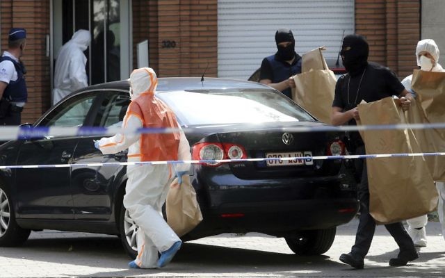 Police and forensic officers at a house search in the Molenbeek district of Brussels on Wednesday, June 21, 2017. (AP Photo/Francois Walschaerts) Police and forensic officers at a house search in the Molenbeek district of Brussels on Wednesday, June 21, 2017. (AP Photo/Francois Walschaerts)