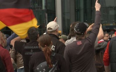 Demonstrators from the 'Third Position' political movement in Berlin. Screenshot from the documentary 'Chosen and Excluded -- Jew Hatred in Europe.' (Courtesy)