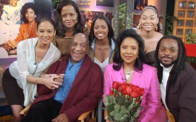 In this Thursday, May 2, 2002 file photo, members of Bill Cosby's television family, the Huxtables, gather in NBC's Today show studio for an interview with co-host Katie Couric, in New York. From left are Sabrina Le Beauf, Tempest Bledsoe, Cosby, Keshia Knight Pulliam, Phylicia Rashad, Raven Symone and Malcolm-Jamal Warner. (AP Photo/Richard Drew)