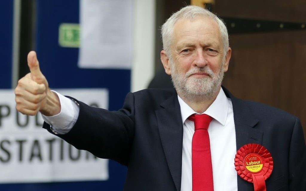 Britain's Labour party leader Jeremy Corbyn gestures as he arrives to vote in the general election at a polling station in London, June 8, 2017. (AP/Frank Augstein)