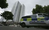 A police van drives past the Chalcots Estate in the borough of Camden, north London, June 25, 2017. (AP Photo/Tim Ireland)