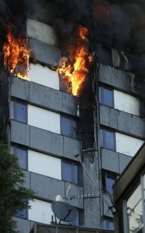 Smoke and flames rise from a building on fire in London, Wednesday, June 14, 2017. (AP/Matt Dunham)