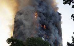 Smoke and flames rise from a high-rise building on fire in London, June 14, 2017.  (AP/Matt Dunham)