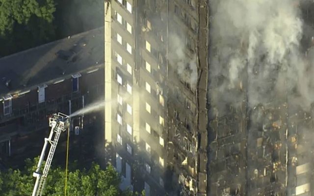 In this photo taken from video, smoke rises from a high-rise apartment building on fire in London, Wednesday, June 14, 2017. (Sky News via AP)