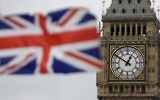 A British flag is shown near Big Ben's clock tower in front of the Houses of Parliament in central London, March 29, 2017. (AP Photo/Matt Dunham)