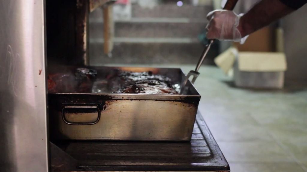 Pulling fresh braised brisket out of the oven at David's Brisket House in Brooklyn, New York. (YouTube Screenshot) Pulling fresh braised brisket out of the oven at David's Brisket House in Brooklyn, New York. (YouTube Screenshot)