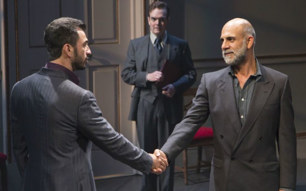 Michael Aronov and Anthony Azizi shake hands, Jefferson Mays in the background in 'OSLO.' (Courtesy/T. Charles Erickson) Michael Aronov and Anthony Azizi shake hands, Jefferson Mays in the background in 'OSLO.' (Courtesy/T. Charles Erickson)