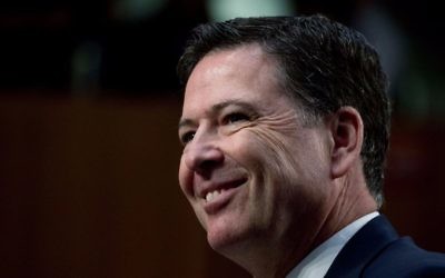 Former FBI Director James Comey smiles during a Senate Intelligence Committee hearing on Capitol Hill, Thursday, June 8, 2017, in Washington. (AP Photo/Andrew Harnik)