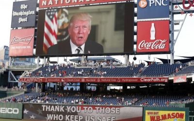 A message from President Donald Trump is shown on the video board before the Congressional baseball game, Thursday, June 15, 2017, in Washington. The annual GOP-Democrats baseball game raises money for charity. (AP Photo/Alex Brandon) 