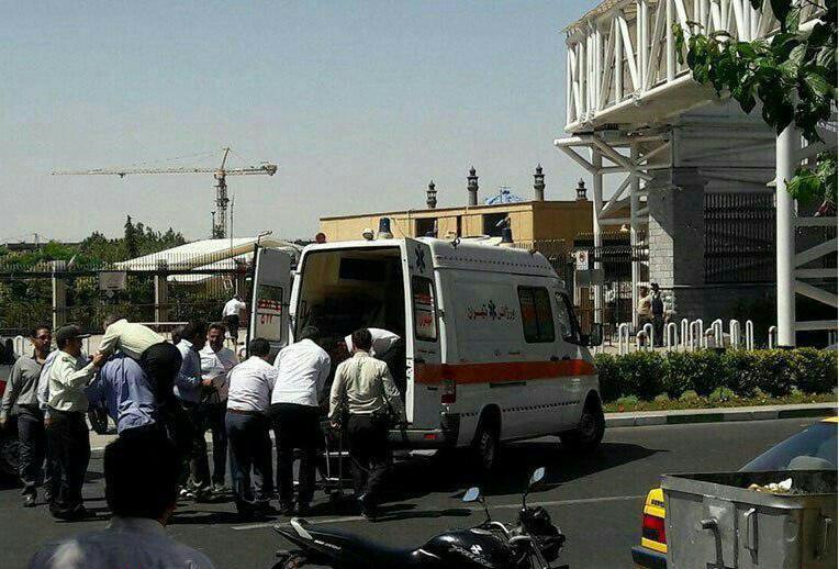 An injured police officer receives medical care outside the Iranian parliament after a shooting attack on Wednesday, June 7, 2017 (screen capture: Mehr news agency) An injured police officer receives medical care outside the Iranian parliament after a shooting attack on Wednesday, June 7, 2017 (screen capture: Mehr news agency)