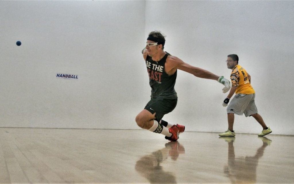 Handball star David Fink dives for a ball. (Courtesy) Handball star David Fink dives for a ball. (Courtesy)