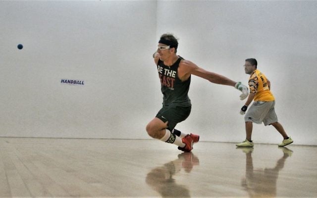 Handball star David Fink dives for a ball. (Courtesy)