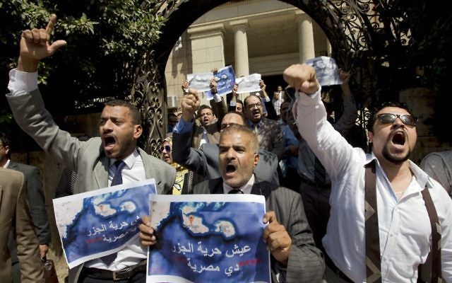 Dozens of lawyers shout slogans during a protest against the accord to hand over control of two strategic Red Sea islands, Tiran and Sanafir, to Saudi Arabia in front of the lawyers syndicate in Cairo, June 13, 2017. (AP/Amr Nabil) Dozens of lawyers shout slogans during a protest against the accord to hand over control of two strategic Red Sea islands, Tiran and Sanafir, to Saudi Arabia in front of the lawyers syndicate in Cairo, June 13, 2017. (AP/Amr Nabil)