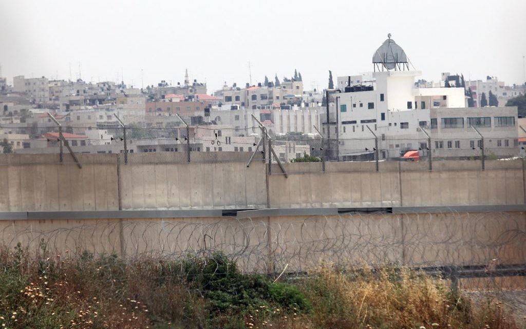 The West Bank town of Qalqilya is seen behind Israel's security barrier. (Yossi Zamir/Flash90) The West Bank town of Qalqilya is seen behind Israel's security barrier. (Yossi Zamir/Flash90)