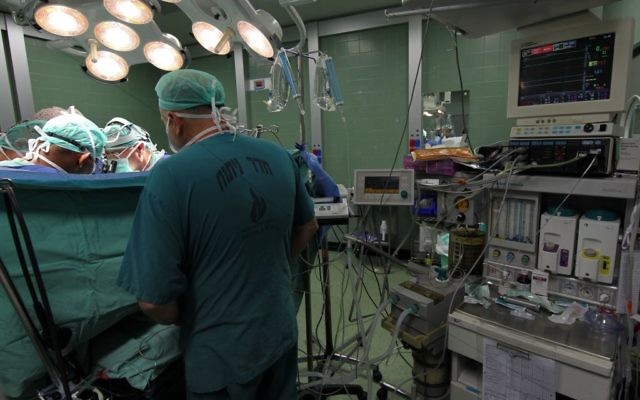 A monitor making sure vital signs of the patient are in check during open heart surgery at Wolfson Medical Center in Holon , September 12, 2011. (Illustrative photo: Nati Shohat/Flash90) A monitor making sure vital signs of the patient are in check during open heart surgery at Wolfson Medical Center in Holon , September 12, 2011. (Illustrative photo: Nati Shohat/Flash90)
