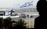 A passenger observes the runway from a window at Israel's Ben Gurion International Airport near Tel Aviv, April 21, 2013. (Flash90)