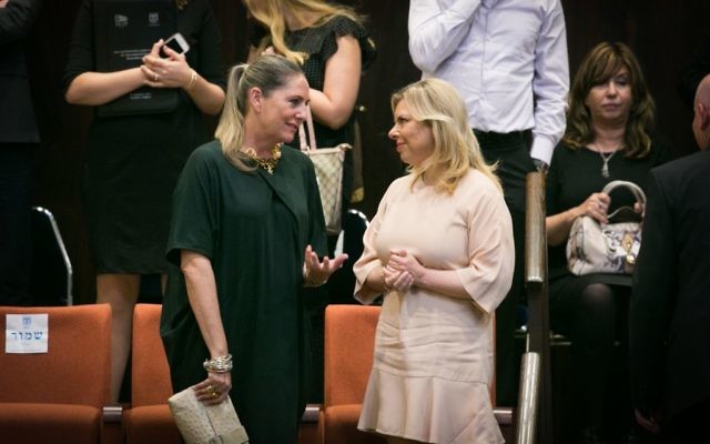 Michal Herzog, wife of opposition leader Isaac Herzog, speaks to Sara Netanyahu at the opening of the winter session of the Knesset on October 12, 2015 (Miriam Alster/FLASH90) Michal Herzog, wife of opposition leader Isaac Herzog, speaks to Sara Netanyahu at the opening of the winter session of the Knesset on October 12, 2015 (Miriam Alster/FLASH90)