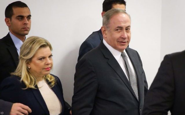Prime Minister Benjamin Netanyahu and his wife Sara arrive to the Magistrates Court in Tel Aviv to a court hearing against journalist Igal Sarna on March 14, 2017. (Moti Kimchi/Pool) Prime Minister Benjamin Netanyahu and his wife Sara arrive to the Magistrates Court in Tel Aviv to a court hearing against journalist Igal Sarna on March 14, 2017. (Moti Kimchi/Pool)