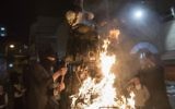 Ultra-Orthodox Jews burn an effigy of an Israeli soldier during celebrations marking the Jewish holiday of Lag B'Omer in the Jerusalem neighborhood of Mea Shearim, May 13, 2017 (Noam Revkin Fenton/Flash90)