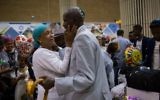 Family members embrace at Ben Gurion Airport as 72 new immigrants from Ethiopia arrive on June 6, 2017.  (Miriam Alster/Flash90)