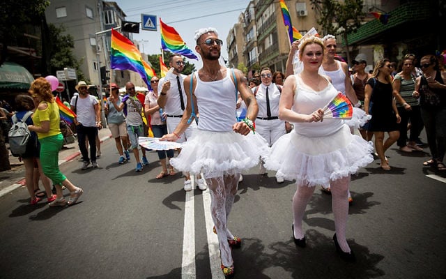 A man and a woman wearing tights and ballet dresses walking during the annual Gay Pride Parade in Tel Aviv, on June 9, 2017. Friday's Parade marks the end of Pride Week in Tel Aviv, internationally acclaimed as one of the most proud and gay-friendly cities in the world. (Miriam Alster/Flash90) 