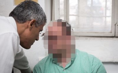 A man is brought to the Jerusalem Magistrate's Court for suspicion of sexually assaulting dozens of women he employed, June 12, 2017. (Hadas Parush/Flash90)