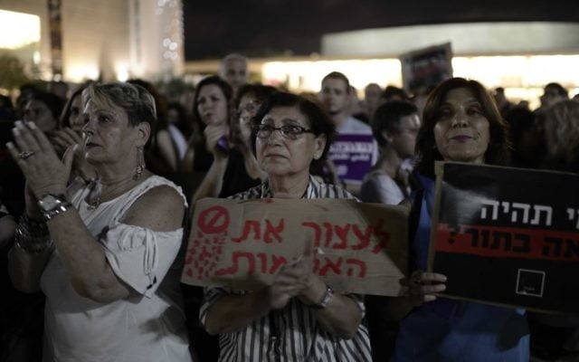 People take part in a protest against violence against women, in Tel Aviv, June 17, 2017. (Tomer Neuberg/ Flash90) People take part in a protest against violence against women, in Tel Aviv, June 17, 2017. (Tomer Neuberg/ Flash90)
