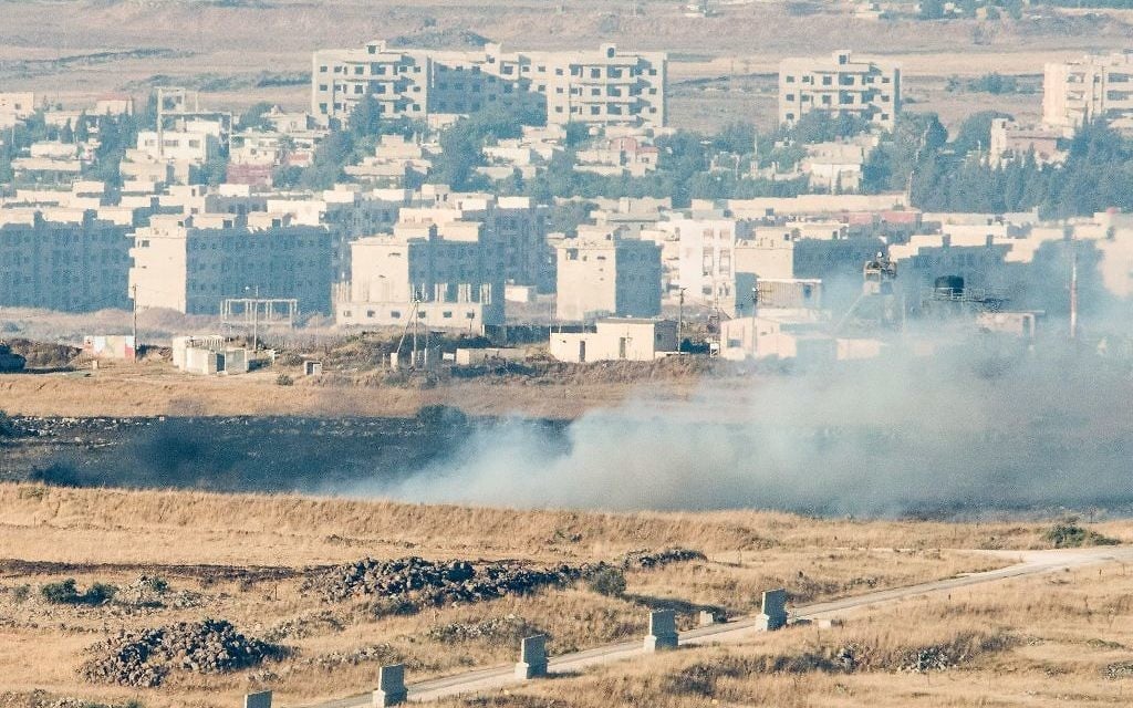 A picture taken from the Israeli side of the border shows smoke rising near the Israeli-Syrian border on June 24, 2017. (Basel Awidat/Flash90)