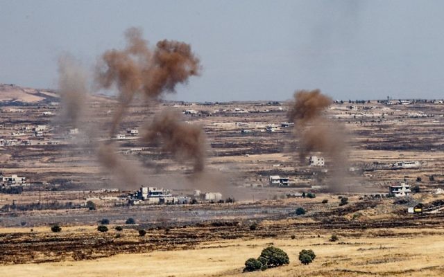 A picture taken from the Israeli side of the border shows smoke rising near the Israeli-Syrian border on the Golan Heights during fights between the rebels and the Syrian army inside Syria, June 25, 2017. (Basel Awidat/Flash90) A picture taken from the Israeli side of the border shows smoke rising near the Israeli-Syrian border on the Golan Heights during fights between the rebels and the Syrian army inside Syria, June 25, 2017. (Basel Awidat/Flash90)