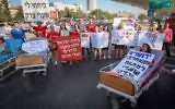 Illustrative: Parents and supporters of young cancer patients from the hematology-oncology department at Hadassah Hospital Ein Kerem protest against Health Minister Yaakov Litzman and the hospital's CEO Zeev Rotstein in Jerusalem on June 27, 2017. (Yonatan Sindel/Flash90)