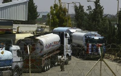 Egyptian fuel trucks parked inside the Gaza power plant in Nusseirat, in the central Gaza Strip, Wednesday, June 21, 2017. (AP Photo/Adel Hana)