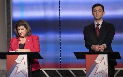 In this June 6, 2017 photo, candidates in Georgia's 6th Congressional District race Republican Karen Handel, left, and Democrat Jon Ossoff prepare to debate in Atlanta. (Branden Camp/Atlanta Journal-Constitution via AP)