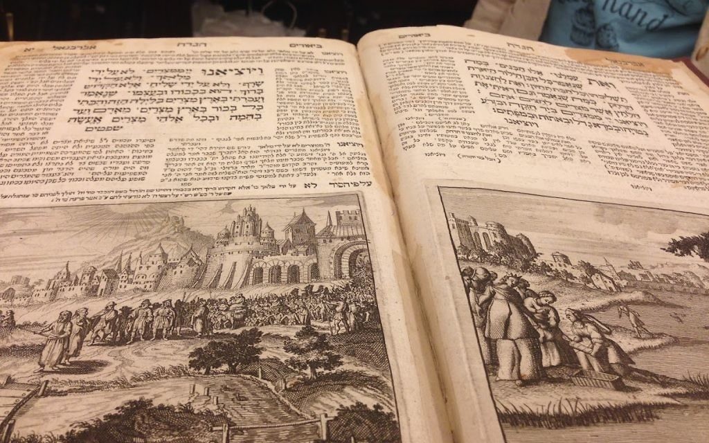 A wine-stained page from the ancient haggadah in the Schneerson Collection. (Courtesy)