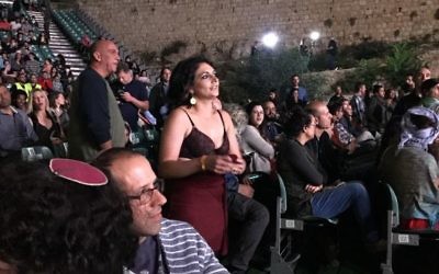 A woman, center, strips down to her bra in a show of protest to Culture and Sports Minister Miri Regev during the opening of the Israeli Film Festival in Jerusalem, June 1, 2017. (Jessica Steinberg/Times of Israel)