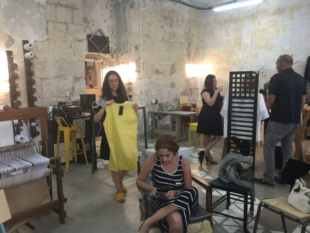 Adi Yair's loom and handwoven designs in the third corner of the Parallel studio (Jessica Steinberg/Times of Israel)