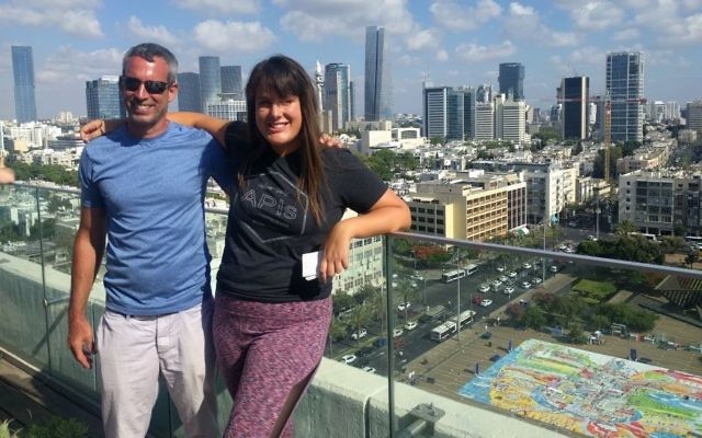 Amit Trainin, left, and Sharona Karni Cohen on the rooftop of the Tel Aviv Municipality building, overlooking the largest yoga mat art installation in honor of the third International Yoga Day on June 21, 2017. (Melanie Lidman/Times of Israel)