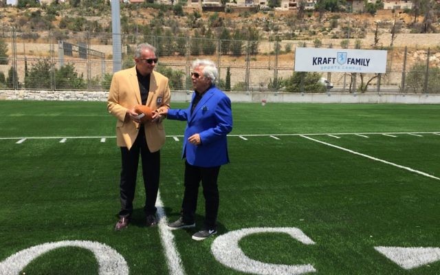 New England Patriots owner Robert Kraft (right) with NFL Hall of Fame member Joe Montana at the Kraft Family Sports Campus inaugurated in Jerusalem in 2017 (Jessica Steinberg/Times of Israel)