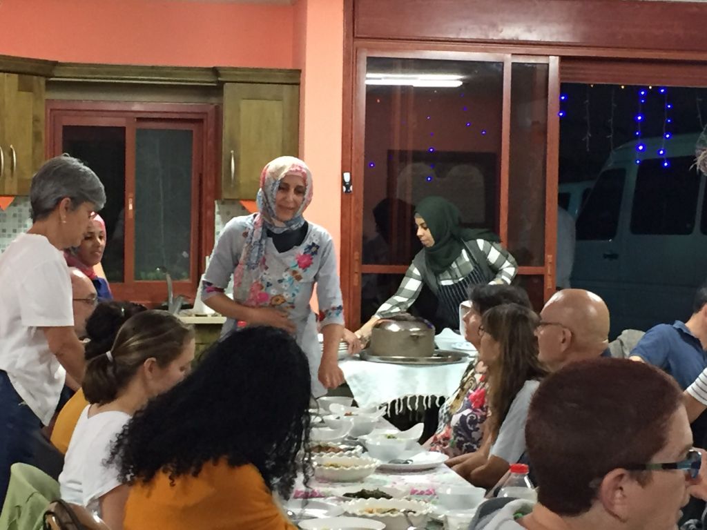 Proprietress of an in-house restaurant Manal Karaman describes to participants of the Umm Al-Fahm Ramadan Nights tour what food she has prepared for their break-fast meal, June 22, 2017. (Amanda Borschel-Dan/Times of Israel) Proprietress of an in-house restaurant Manal Karaman describes to participants of the Umm Al-Fahm Ramadan Nights tour what food she has prepared for their break-fast meal, June 22, 2017. (Amanda Borschel-Dan/Times of Israel)