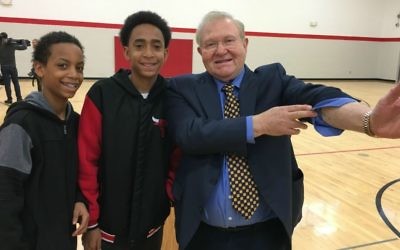 Michael Bornstein shows his tattoo to students in Illinois while on tour speaking about standing up to hate. (Courtesy)