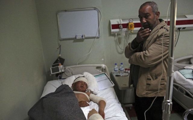 In this Saturday, March 4, 2017 file photo, Nazim Hamid stands next to his injured son Yasir, 11, a victim of a possible IS chemical attack in a hospital Irbil, Iraq (AP Photo/ Khalid Mohammed, File) In this Saturday, March 4, 2017 file photo, Nazim Hamid stands next to his injured son Yasir, 11, a victim of a possible IS chemical attack in a hospital Irbil, Iraq (AP Photo/ Khalid Mohammed, File)