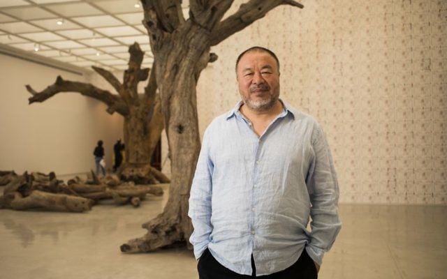 Chinese artist Ai Weiwei poses before the opening of his exhibition in the Israel Museum in Jerusalem, Thursday, June 1, 2017. (AP Photo/Dan Balilty)