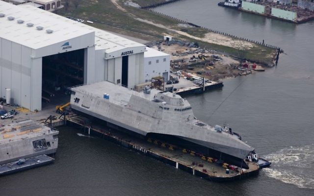 An aerial view of the US Navy littoral combat ship USS Gabrielle Giffords (LCS-10) during its launch sequence at the Austal USA shipyard, Mobile, Alabama, February 24, 2015.  (U.S. Navy photo, public domain)