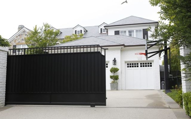 The freshly repainted front gate of a home belonging to Cleveland Cavaliers' LeBron James, May 31, 2017. (AP Photo/Damian Dovarganes)