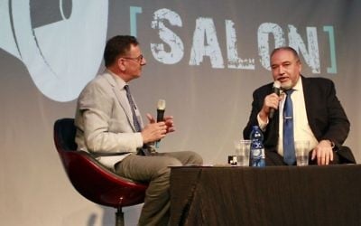 Defense Minister Avigdor Liberman, right, speaks with journalist Matthew Kalman at an event organized by The Times of Israel and the Tel Aviv International Salon at the Tel Aviv port on June 15, 2017. (Judah Ari Gross/Times of Israel)