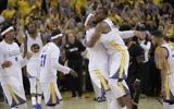 Golden State Warriors players celebrate after beating the Cleveland Cavaliers in Game 5 of basketball's NBA Finals in Oakland, California, June 12, 2017. (AP Photo/Marcio Jose Sanchez)